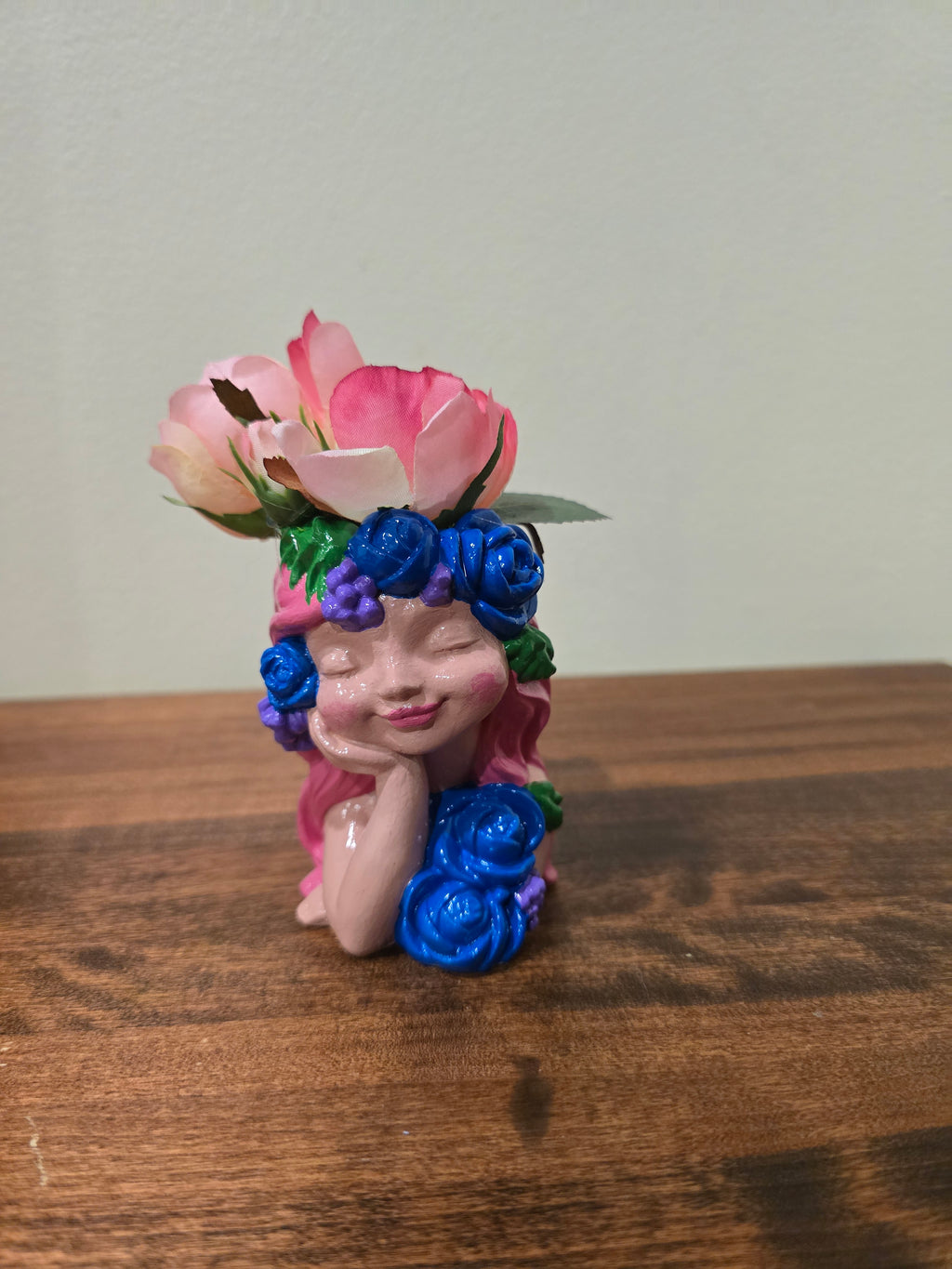 Pink little girl with Artificial Flowers.