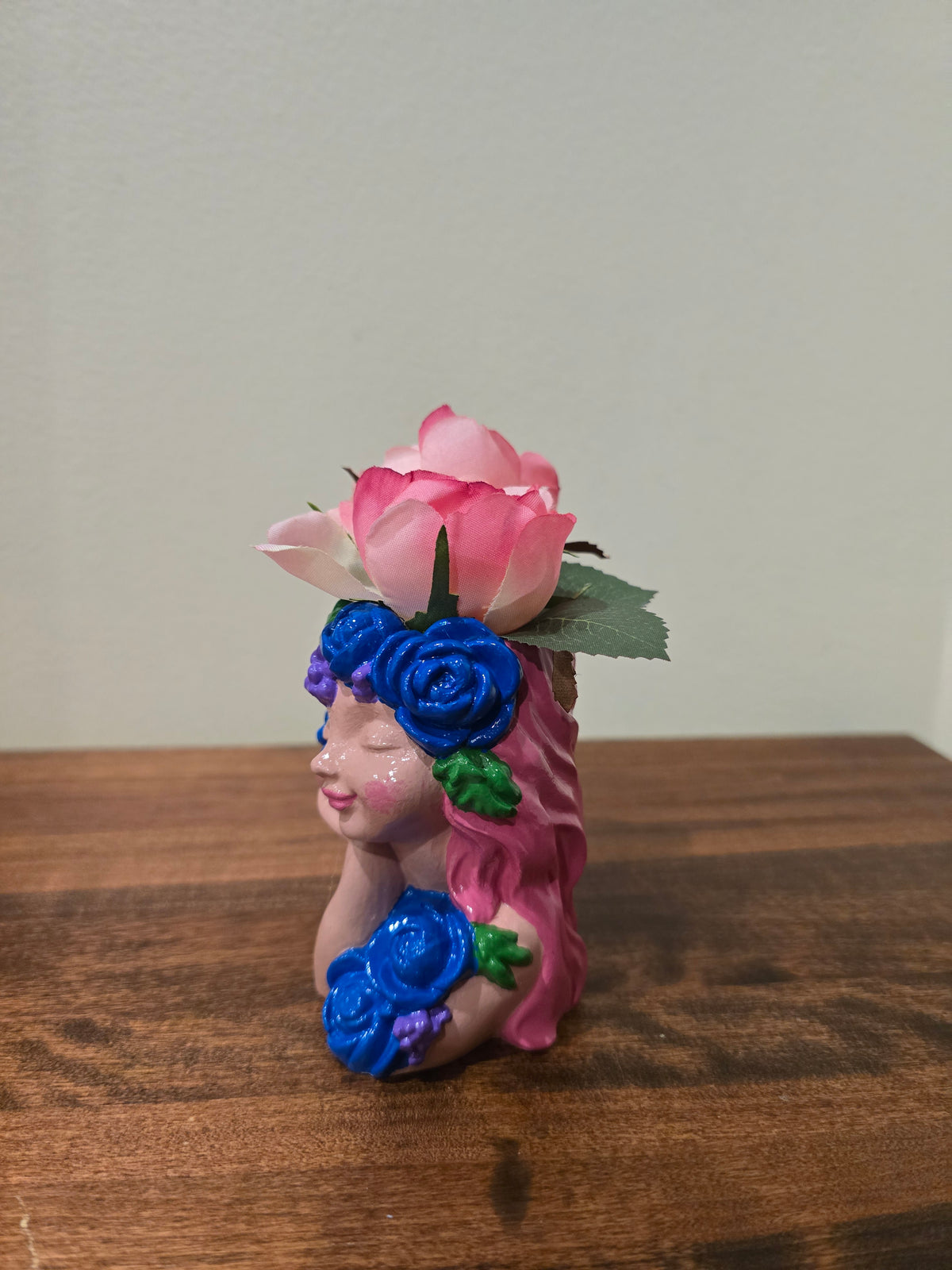 Pink little girl with Artificial Flowers.