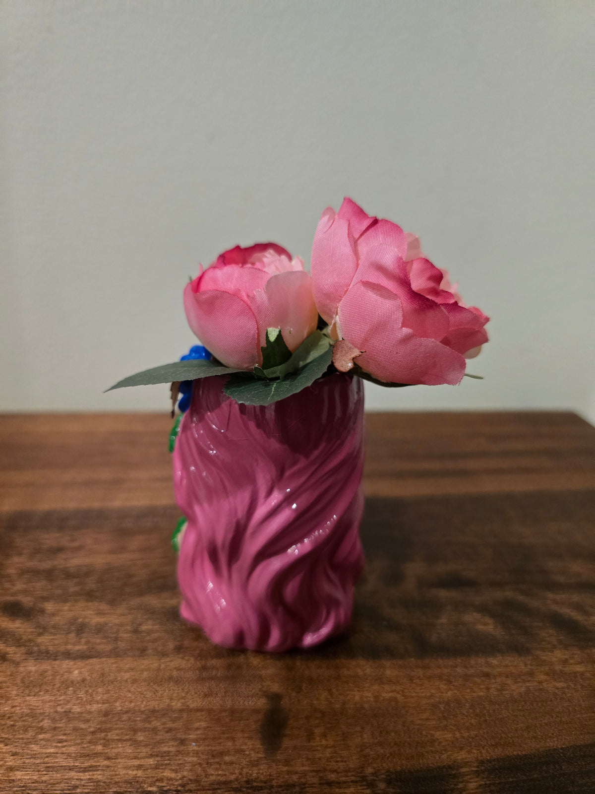 Pink little girl with Artificial Flowers.