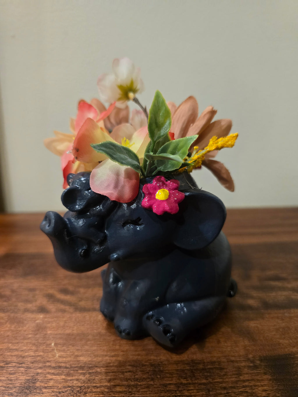 Mini Elephant with Artificial flowers.