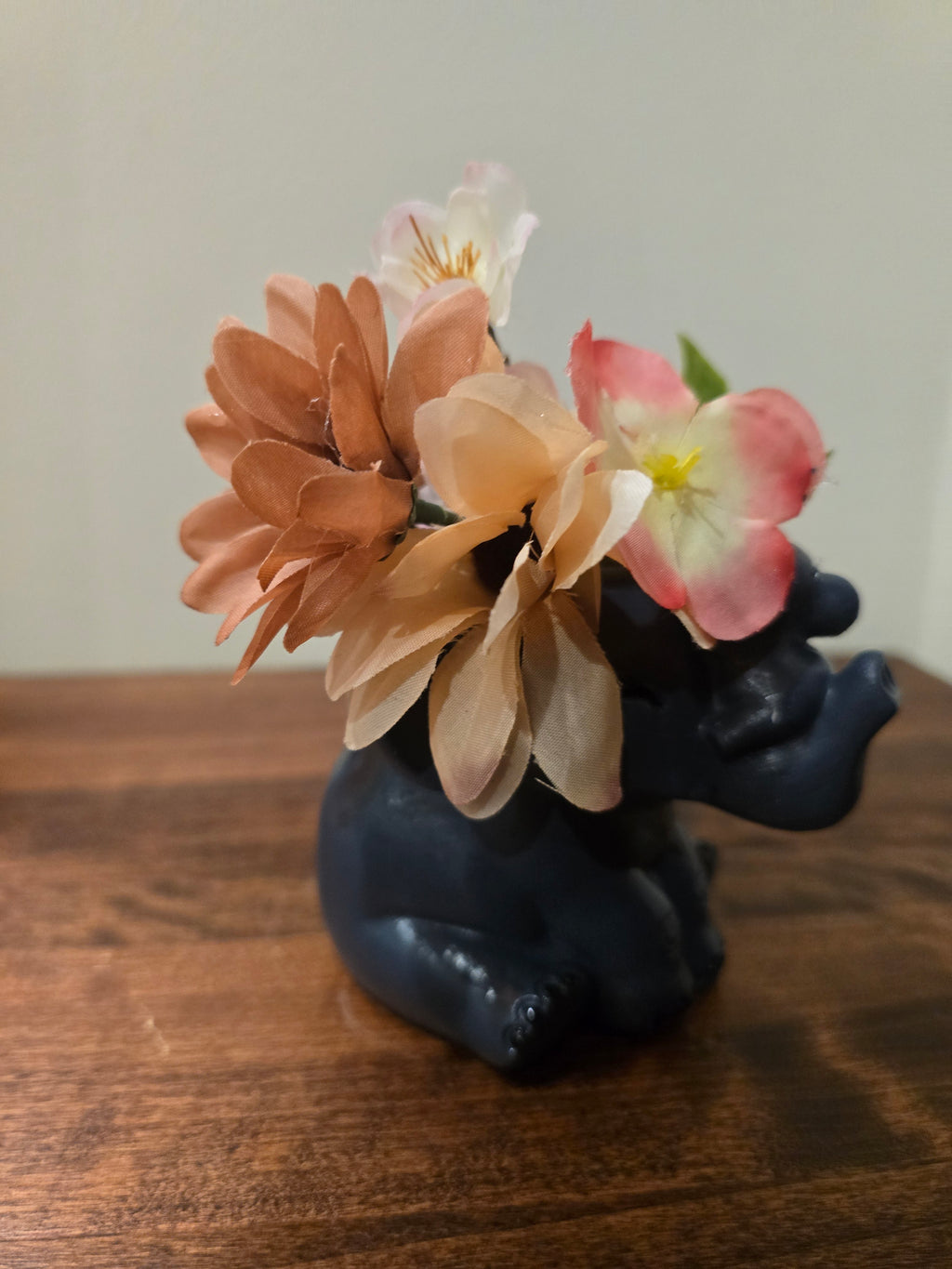 Mini Elephant with Artificial flowers.