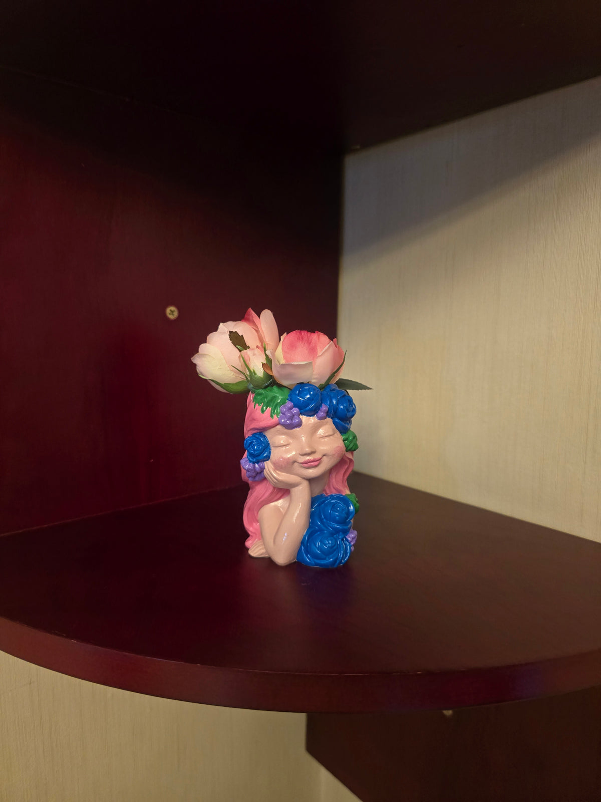 Pink little girl with Artificial Flowers.